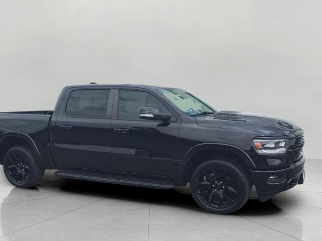 2021 RAM 1500 Laramie 4x4 Crew Cab 5'7 Box in Diamond Black Crystal Pearlcoat — front three-quarter view