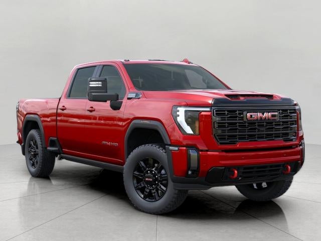 2026 GMC Sierra 2500 HD AT4 in Volcanic Red Tintcoat — front three-quarter view