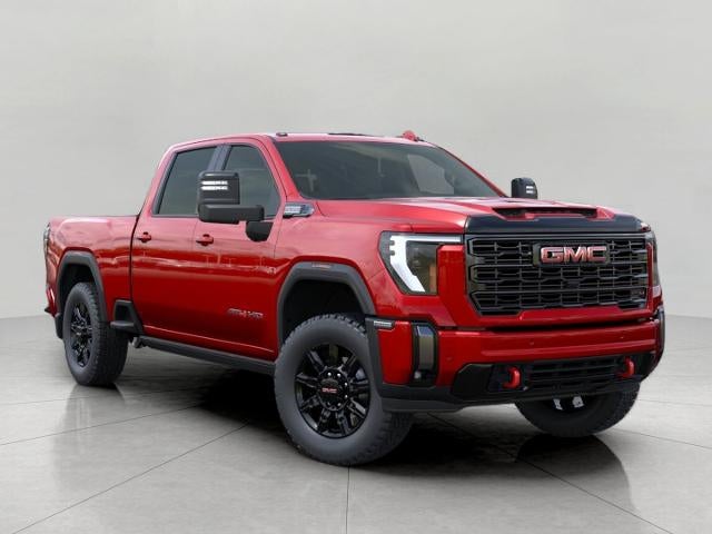 2026 GMC Sierra 2500 HD AT4 in Volcanic Red Tintcoat — front three-quarter view